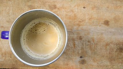 coffee in cup on wood background 