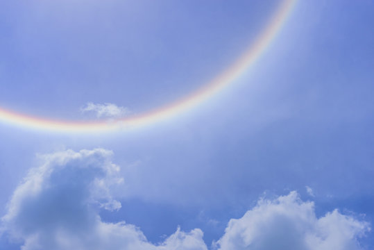 Blur sun halo with cloud in the blue sky.