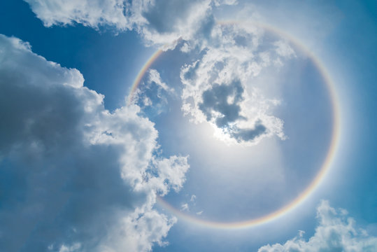 Blur sun halo with cloud in the blue sky.