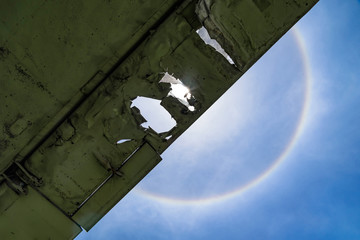 Sun halo with cloud in the blue sky.