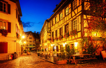 street of Petit France medieval district of Strasbourg at night, Alsace France, retro toned