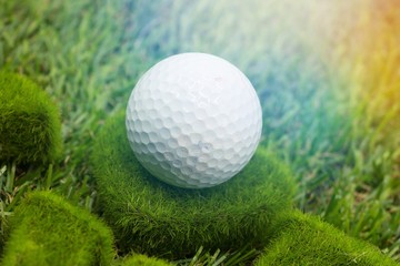 Golf ball is on green grass