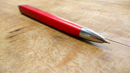 stylish pen on wood background