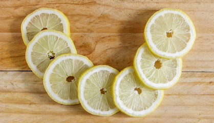 Lemon slices on the  wooden table. Top view.