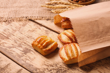 Delicious pastries on wooden table
