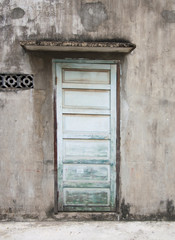Naklejka na ściany i meble Town house in Vietnam. The mysterious door.