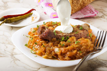 Cabbage stew with Smoked Pork Ribs, cream and green parsley