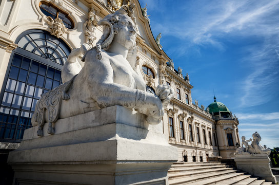 Upper Belvedere Castle (Schloos Belvedere) in Vienna, Austria. Detail of the facade and of the sphinx sculpture seen from the public park around the palace