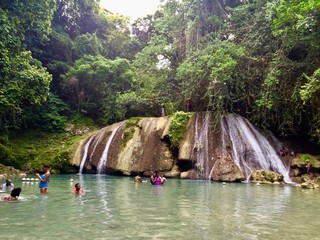Relaxation and adventure at beautiful Reach Falls, a tropical eco waterfall attraction in Jamaica...