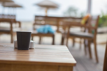 Drinking coffe at beach bar