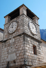 Fototapeta na wymiar Tower with a clock in the old town of Kotor (Montenegro)