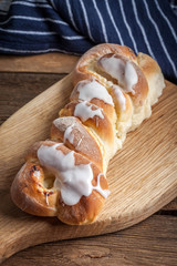 Sweet bun on a cutting board.