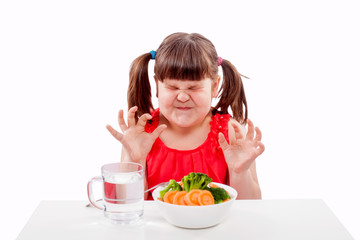 Small girl child hates healthy food. Child isolated on white background