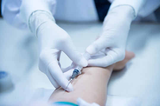 Medical technique with petient in laboratory.