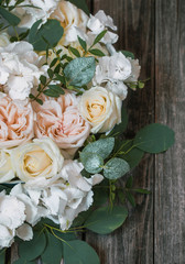 Flower arrangement on wooden background