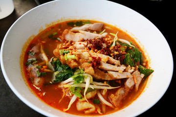 Spicy tom yam pork noodle soup with lemongrass, chilly pasted and lime juice or TOM YAM noodle.