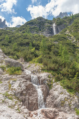 Waterfalls at the foot of the dolomitic peaks, Dolomites, Italy