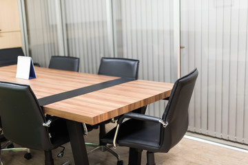 black leather office chair and table in the meeting room in selective focus.