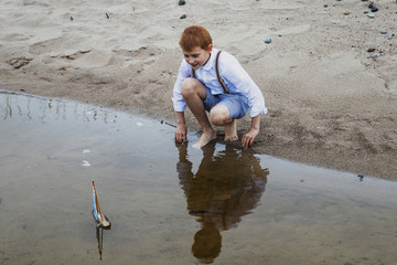 the boy is given a boat at sea