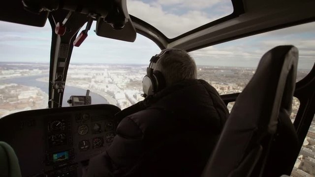 Pilot in helicopter indoors shot