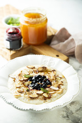 Oatmeal porridge with jam, honey and nuts
