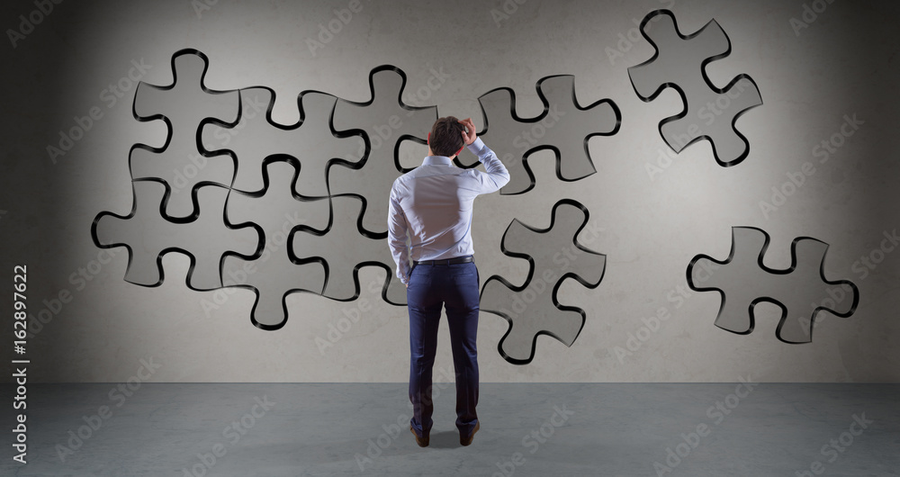 Poster Businessman searching puzzle solution on a wall 3D rendering