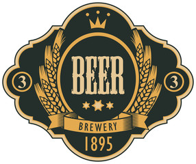 Template beer label with coat of arms, wreath of wheat and ribbon in curly frame. Vector label for beer or brewery on black background in retro style.