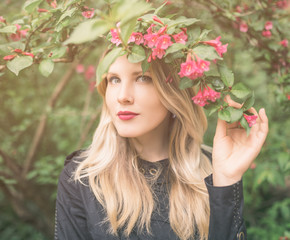 Fototapeta premium Outdoors portrait of beautiful young woman. Selective focus.