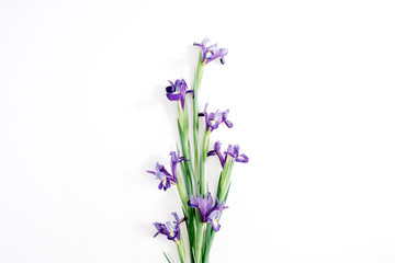 Naklejka premium Beautiful purple iris flowers bouquet on white background. Flat lay, top view