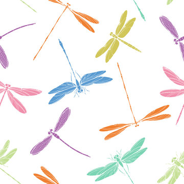 Seamless pattern with colorful and bright dragonflies on a white background.