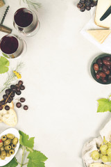 Wine and snack set. Grey marble background, top view, copy space