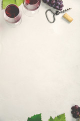 Wine and grapes over grey concrete background © Natalia Klenova