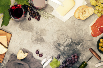 Wine and snack set. Grey marble background, top view, copy space