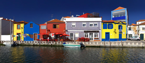 Fototapeta na wymiar 'Splash of colours': Riverside cafe in Aveiro