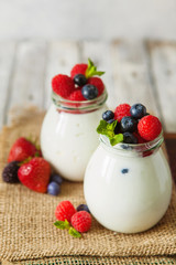 Natural yogurt with fresh berries and nuts