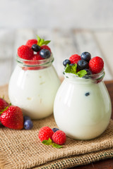 Natural yogurt with fresh berries and nuts