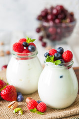 Natural yogurt with fresh berries and nuts