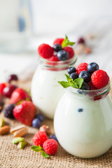 Natural yogurt with fresh berries and nuts