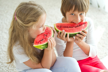 Children eat watermelon 