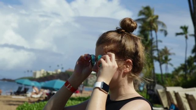 Teen Girl Fixes Her Hair, Adjusts Her Sunglasses, Then Turns And Smiles At Camera, Maui, Hawaii