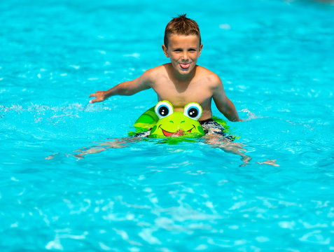 Smiling boy in swimming pool
