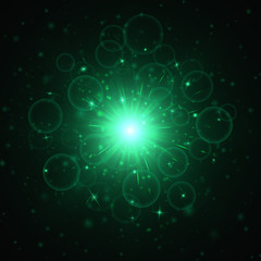 Star explosion with a green light effect for a festive decoration on a dark background
