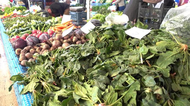 Fethiye, Turkey - 17th of January, 2017:  4K Spinach and other winter vegetables at the local market