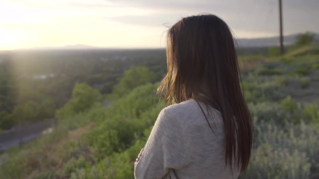 Young Woman Watches Sunset, Her Boyfriend Joins Her, Wraps Her In A Blanket (Slow Motion)