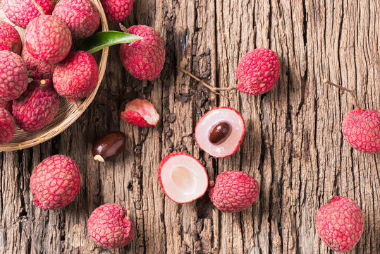 fresh organic lychee fruit on old wood