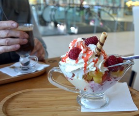 Vanilla ice cream with fresh raspberries, strawberries and pineapple.