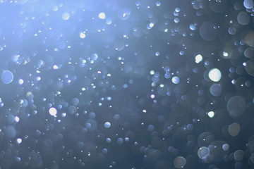 A beautiful and blurry bokeh on a blue background.