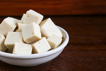 soy tofu or bean curd, Vegetarian food on wooden background.