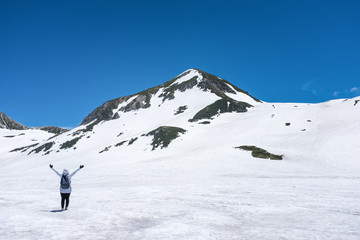 Fototapeta na wymiar woman on snow mountain