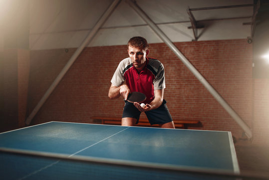 Table tennis, male player with racket and ball